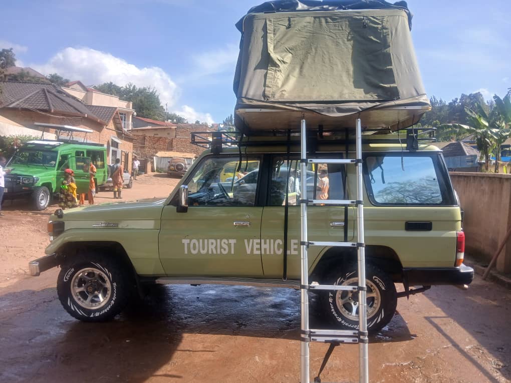 4x4 rental vehicle equipped with a rooftop tent for a camping road trip in Rwanda